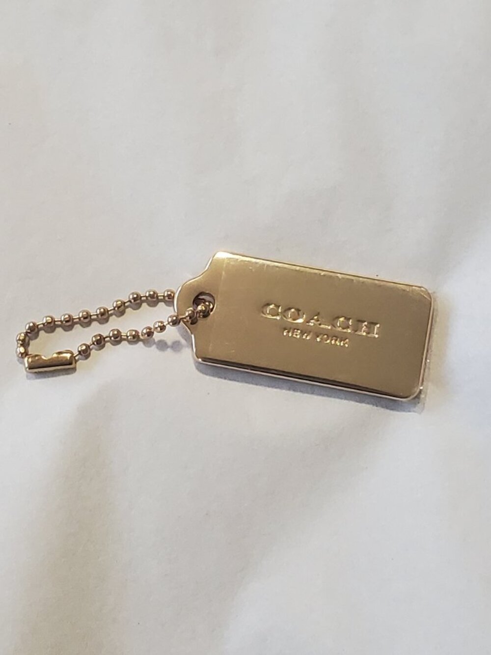 COACH Goldtone Metal Hangtag with chain VINTAGE NEW STILL HAS PROTECTIVE PLASTIC
